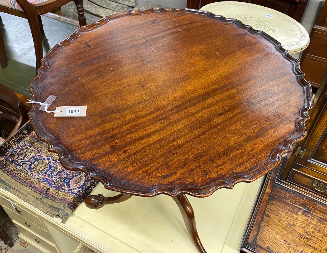 A George III and later circular mahogany tilt top piecrust tea table, diameter 72cm, height 73cm